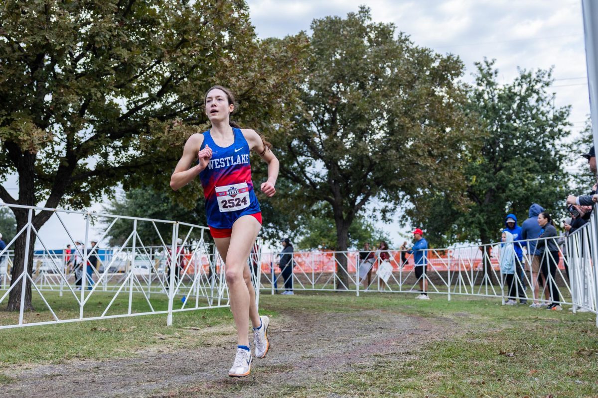 Junior runner Caroline Strong rounds a corner during the UIL State Cross Country meet Nov. 1 at Old Settlers Park.