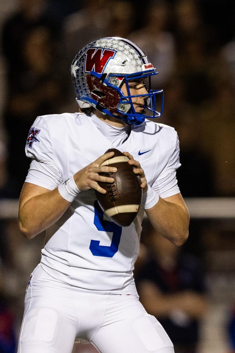 Senior quarterback Rees Wise drops back in the pocket during the playoff game between the Westlake Chaparrals and the Vandegrift Vipers on Nov. 14 at Vandegrift High School.