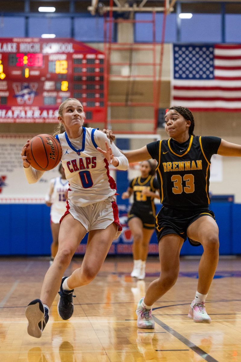 Junior guard Molly Frazer drives to the basket during the game against San Antonio Brennan on Dec. 12 at Al Bennet Court.