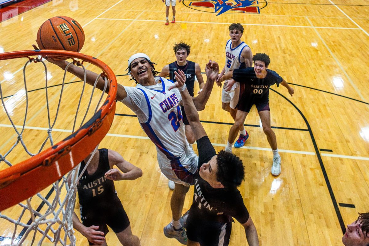 Junior forward Mac Martin attempts a layup during the Chaparrals 42-36 win against the Austin High Maroons on Jan. 28 at Al Bennett Court.