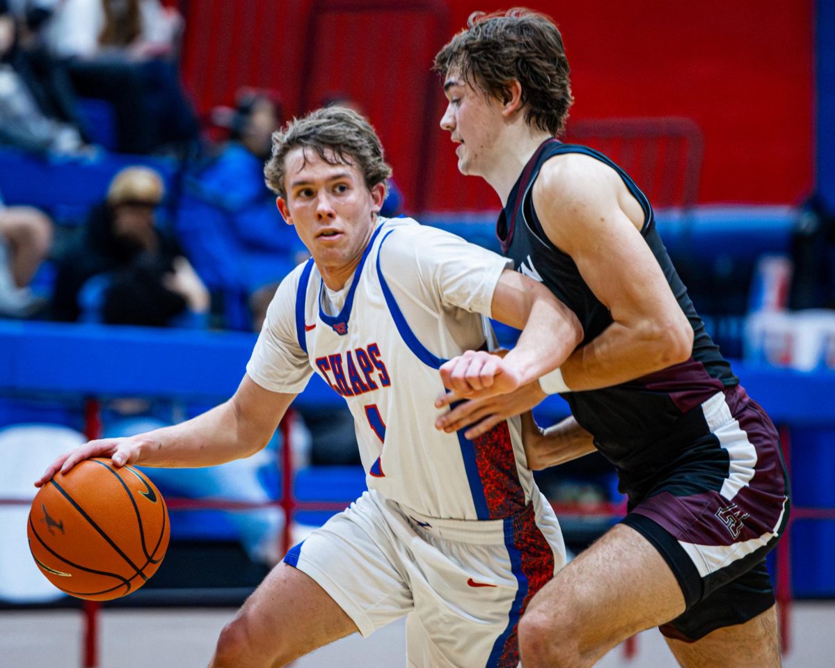 Junior guard Powell Frickenschmidt takes the ball down the court against Austin High Jan. 28 on Al Bennett Court. Frickenschmidt anchored the Chapparal offense in their 42-36 victory. 