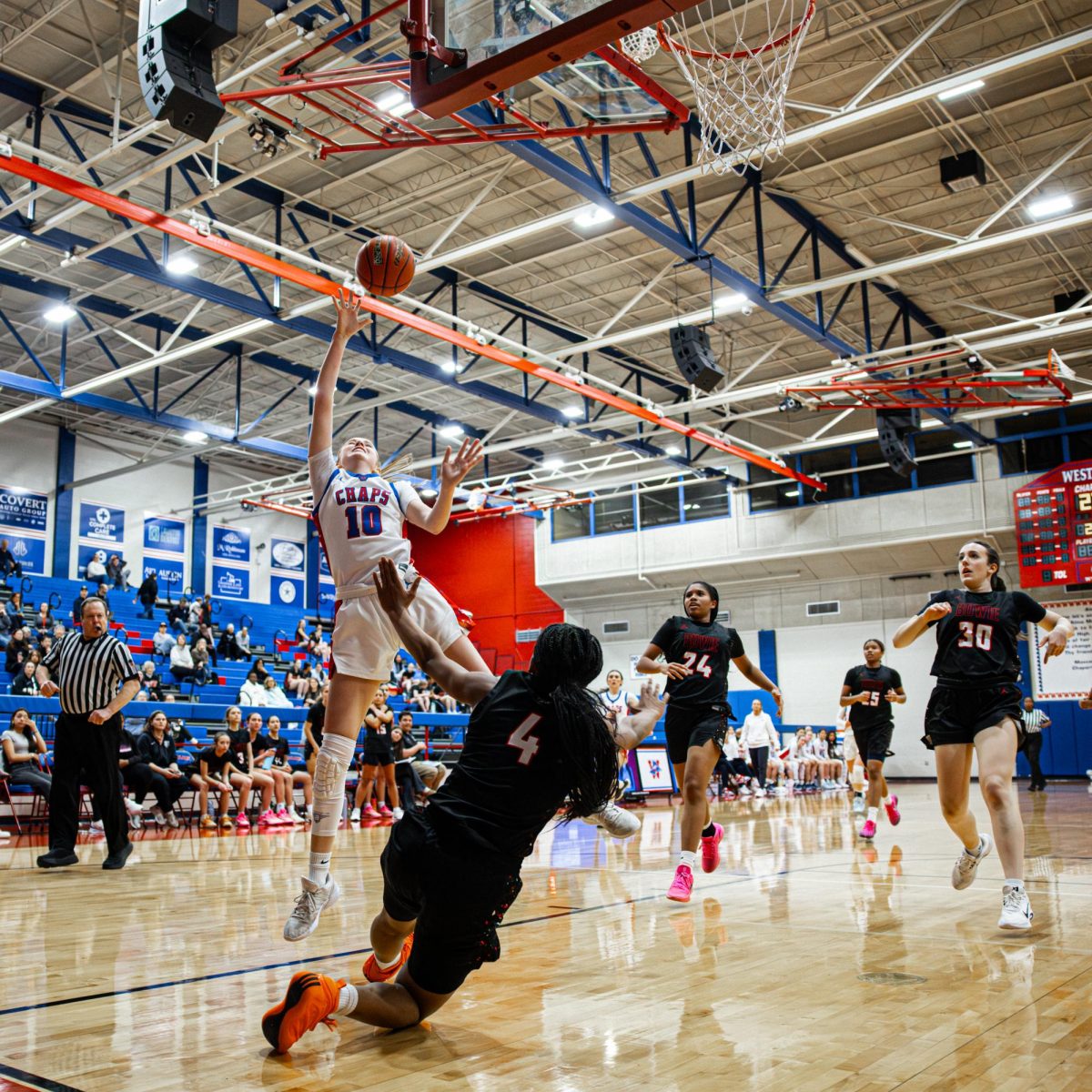 Above the Bowie opponents, forward guard junior Wynn Thorne scores and helps the Chaps win 53-37 Jan. 31.