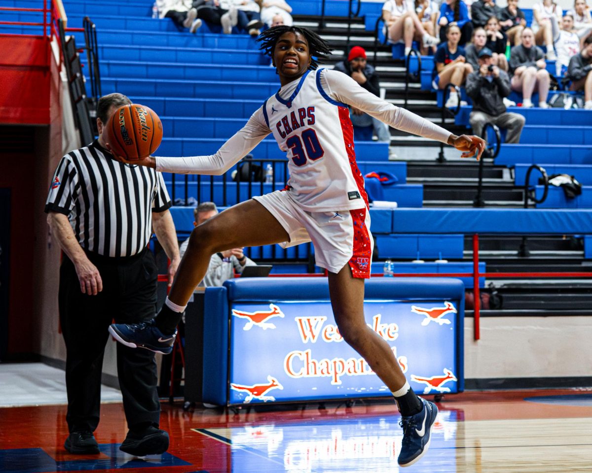Sailing out of bounds, forward guard freshman Geralynn Byers-Veal saves the ball Jan. 31. The Chaps defeated Bowie 53-37.