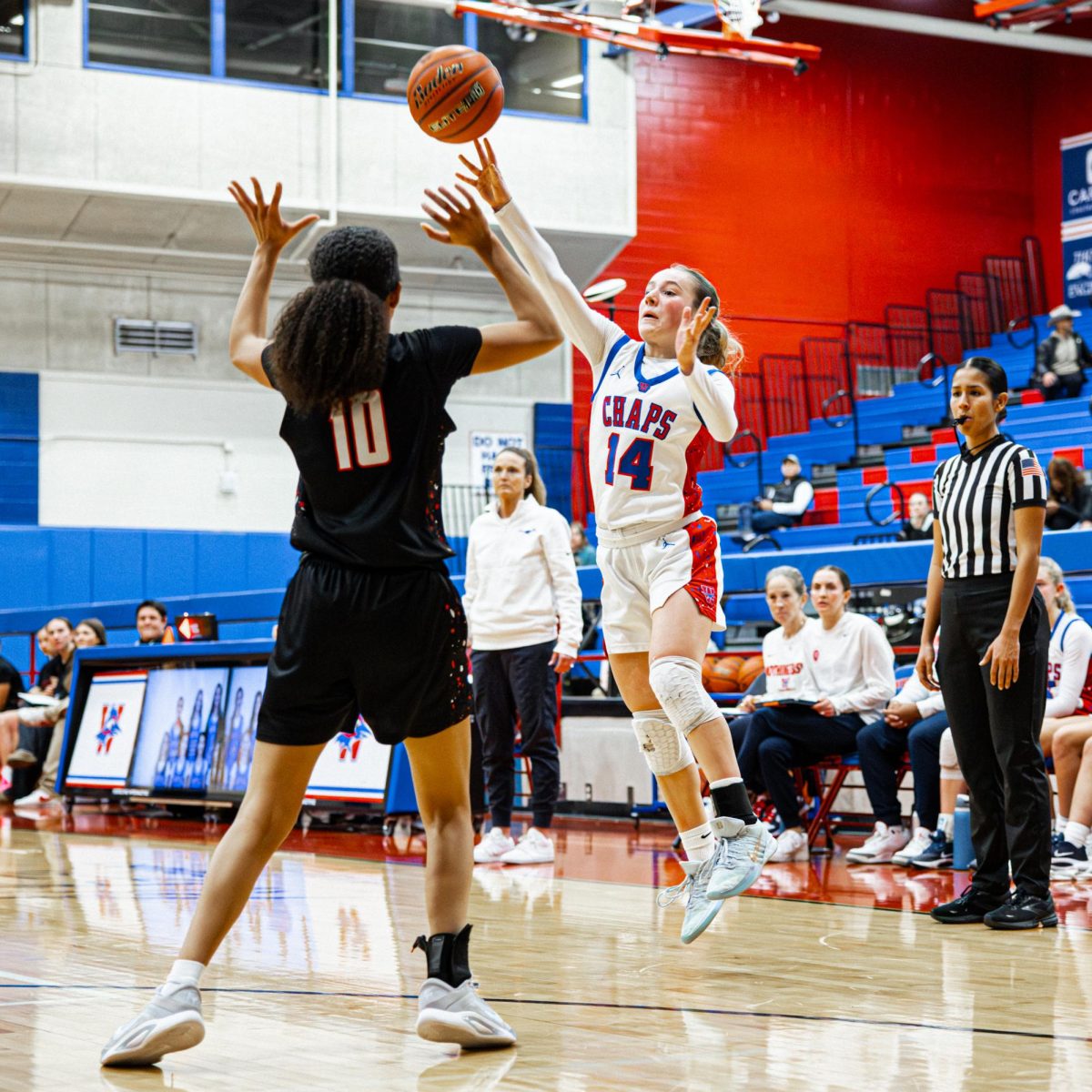 Freshman Peyton Hensle passes the ball over her Bowie defender Jan. 31. The Chaps won 53-37.