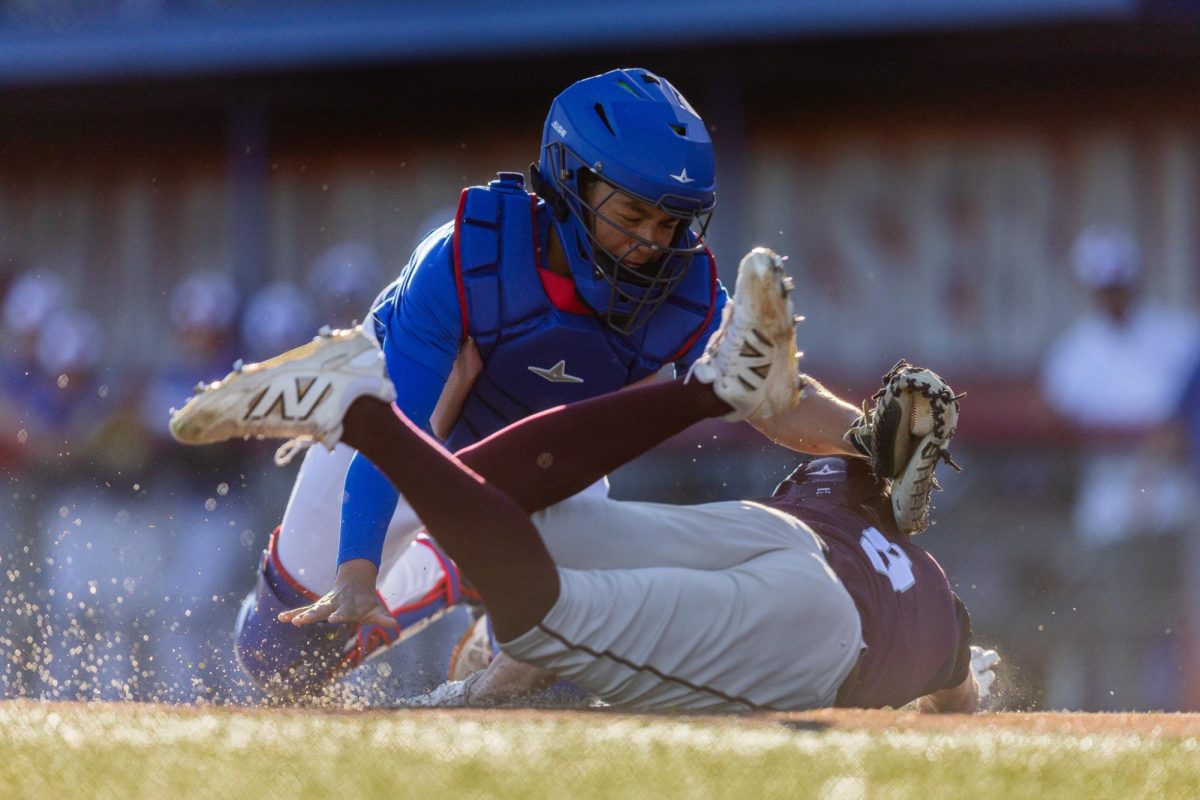 Sophomore catcher Mateo Rincon attempts to tag out a Round Rock player at home plate during a scrimmage against Round Rock on Feb. 6 at Woerner Field.