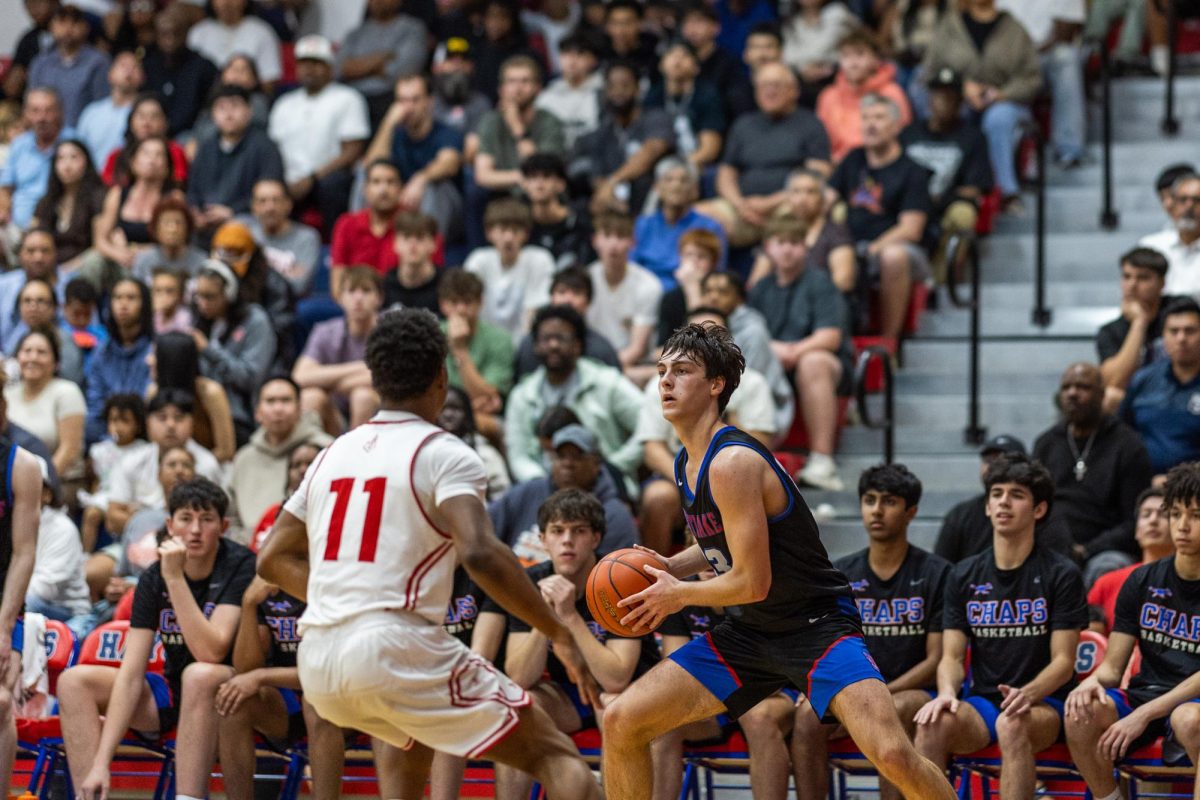Junior guard Alex Allen receives a pass against Judson Mar. 6 at Hays High School. Allen played a crucial role in limiting the Rockets to 46 points. 