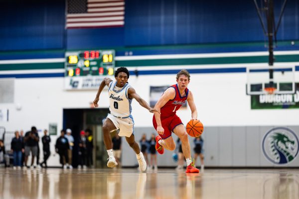 Junior guard Powell Frickenschmidt drives to the basket during the Chaparrals 64-44 win over the Harlan Hawks on Feb. 27 at Long Creek High School.
