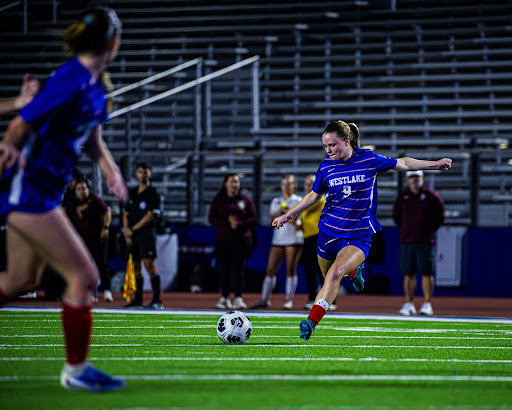 Junior Claire Eckman kicking a place kick against Dripping Springs on Feb. 14.